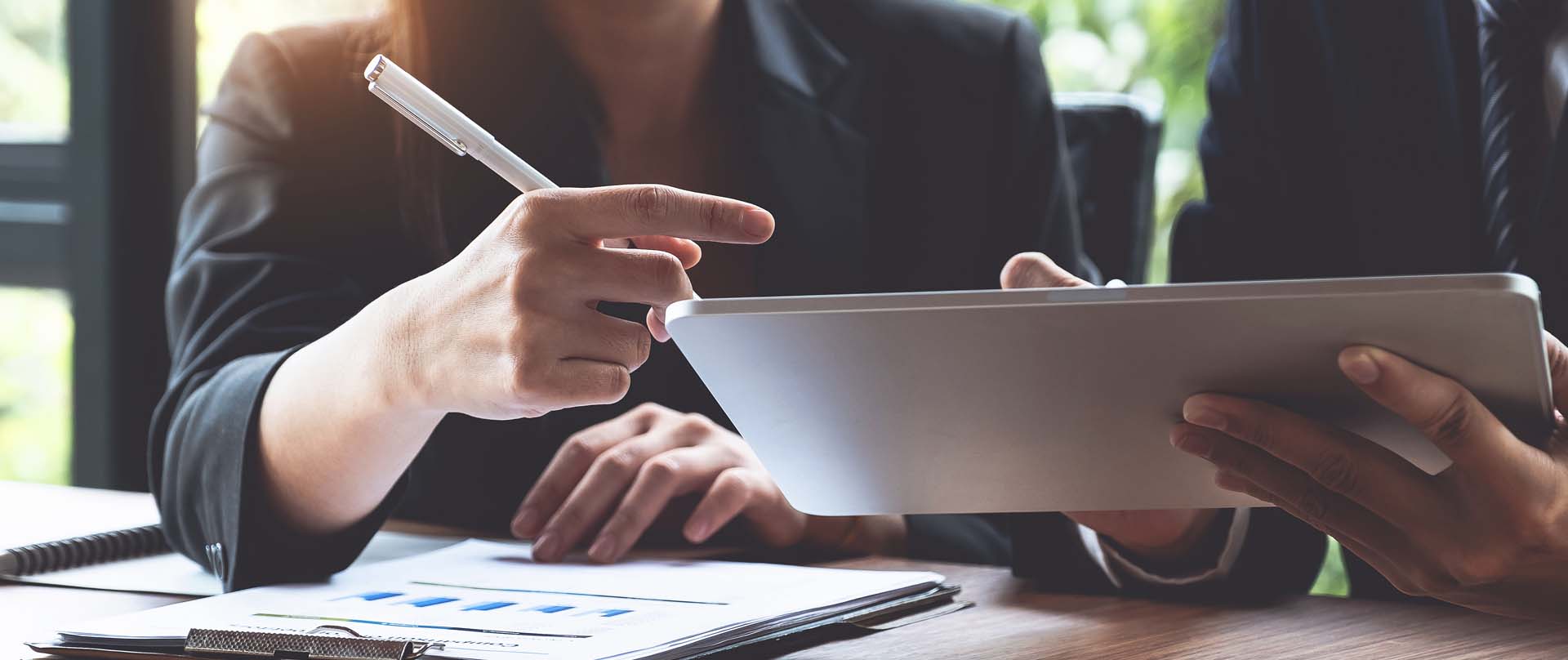 Coworkers Looking Over Reports